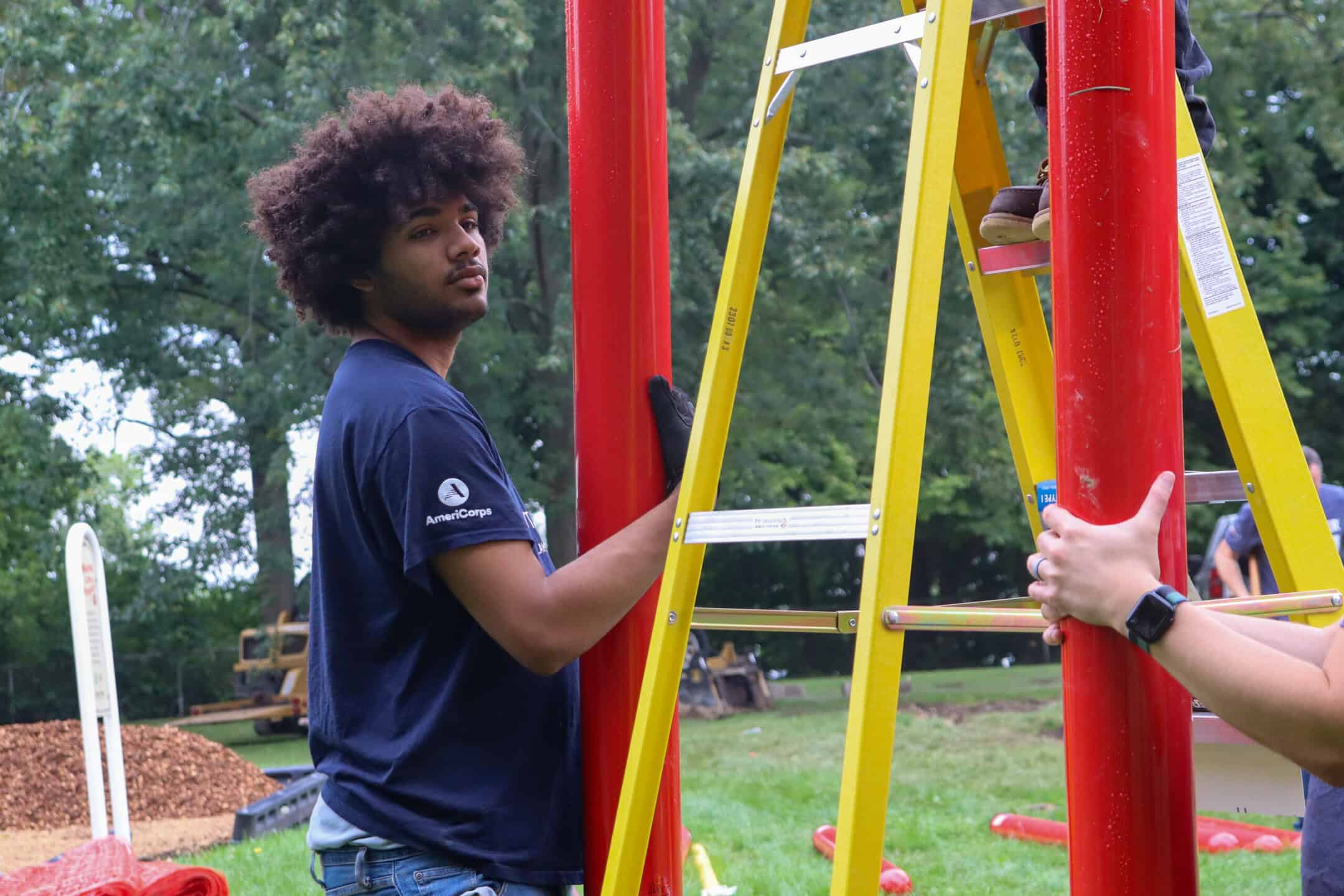 A YBLC participant building a playground in North Chicago as a join service project with Discover and Kaboom!