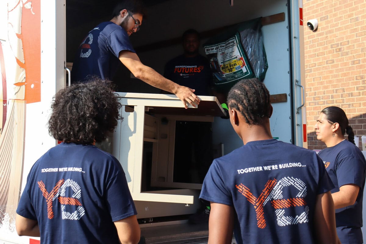 YBLC's youth helping with moving on the Transforming Futures Capital Campaign
