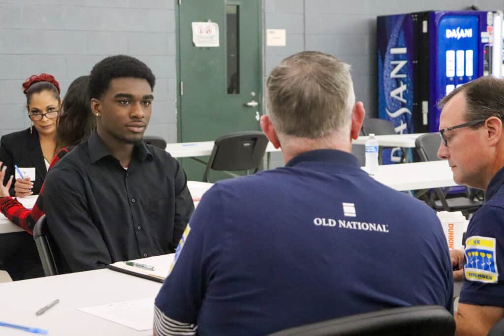 volunteers from old national bank interviewing a yblc participant.